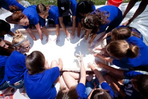 Overhead image of students playing in Oobleck pool